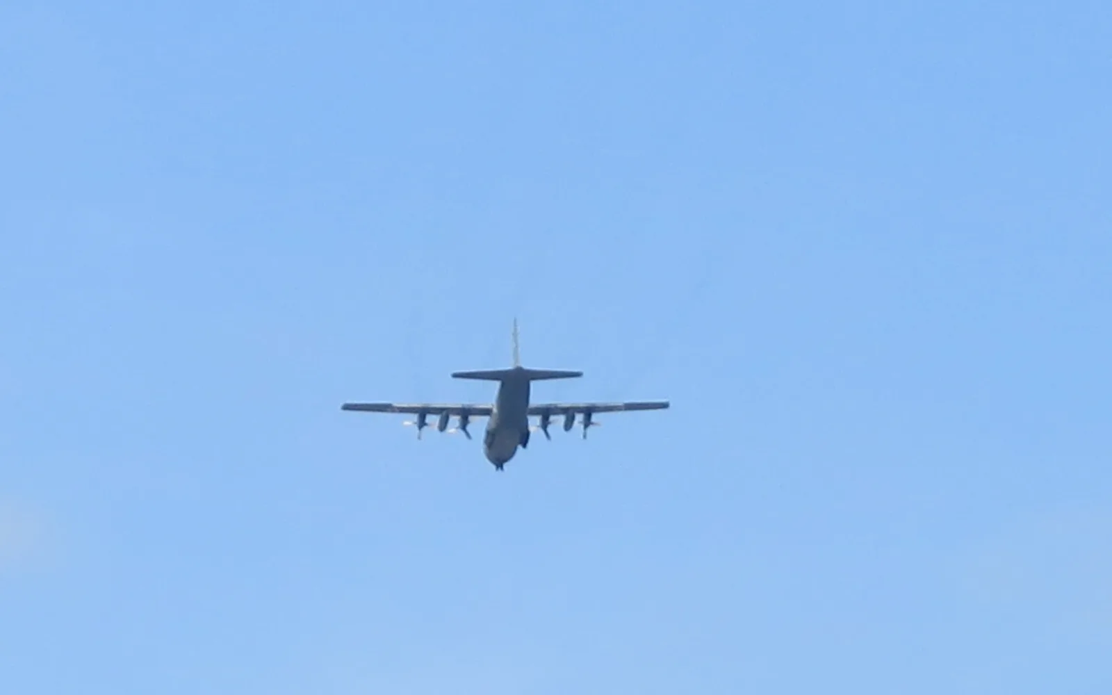 A Lockheed C-130 Hercules cargo aircraft on final approach during the Paris Air Show